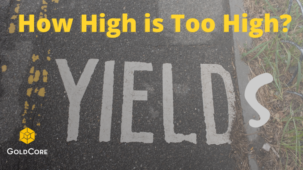 Yield sign on the road with S added in graffiti to make it look like Yields